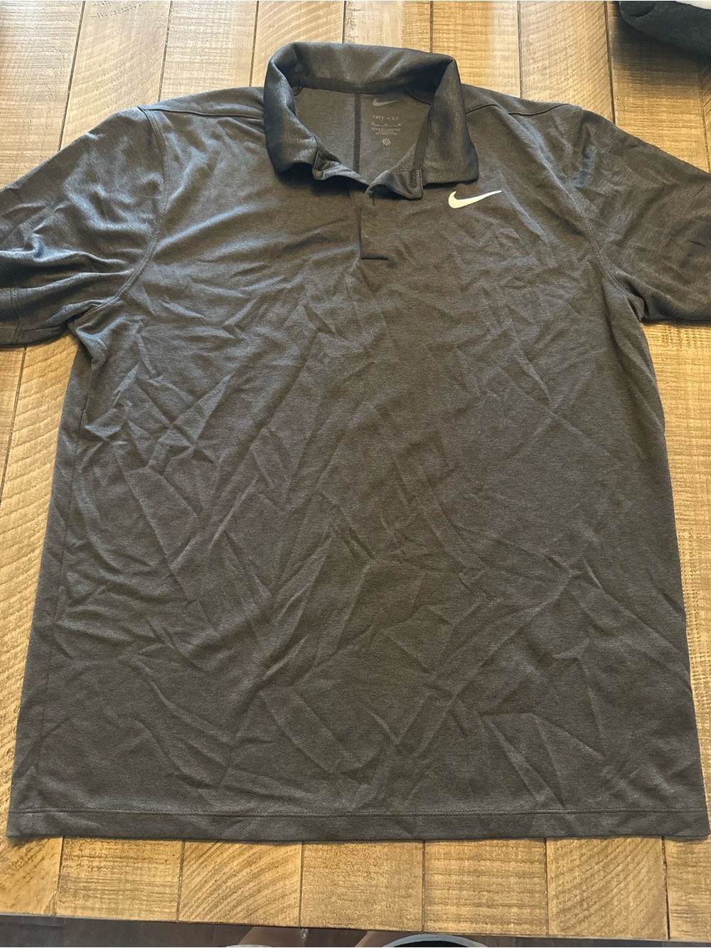 Nike Men's Black Polo with White Swoosh
